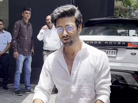 Ranbir Kapoor poses for paps in a white shirt and denims - Bollywood Hungama