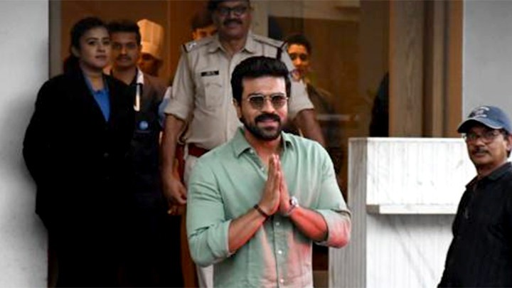 Ram Charan greets paps with a smile at the airport