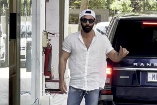 Ranbir Kapoor poses for paps in a white shirt and denims