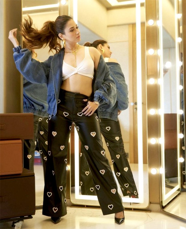 Tamannaah Bhatia looks effortlessly chic and edgy, stealing hearts in black pants, white ribbed bralette, and denim jacket for Jee Karda promotions