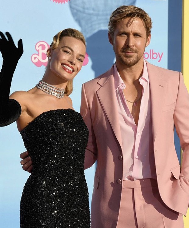 Barbie: Margot Robbie channels 1960′s Solo in the Spotlight doll in Schiaparelli for the LA premiere; Ryan Gosling stuns in crisp peach suit with custom Barbie necklace