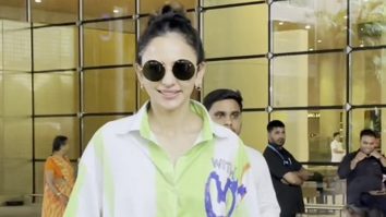 Rakul Preet Singh smiles for a selfie with fans at the airport