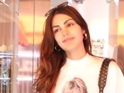 Rhea Chakraborty smiles as she poses for paps with a friend