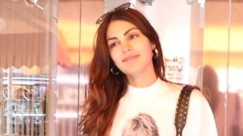 Rhea Chakraborty smiles as she poses for paps with a friend