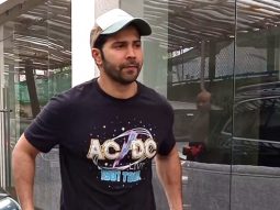 Varun Dhawan poses for a selfie with fans as he gets clicked in the city