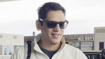 Vijay Varma smiles as he poses for paps at the airport