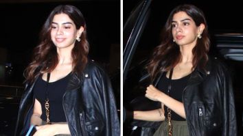 Khushi Kapoor elevates her airport fashion by infusing a stylish twist into wardrobe essentials, pairing a black top, a biker jacket, and a green pleated skirt