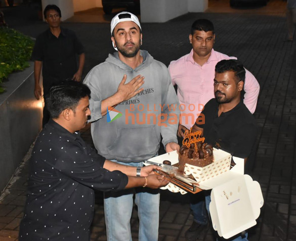 Photos: Ranbir Kapoor snapped cutting cake with fans and the media outside his Bandra home Photos: Ranbir Kapoor snapped cutting cake with fans and the media outside his Bandra home