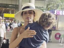 Shriya Saran gets clicked at the airport with her little munchkin!