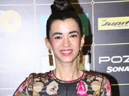 Saba Azad smiles wide in a black floral outfit at the BH OTT India Fest