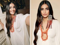 Sonam Kapoor radiates elegance in a flowy white dress, adorned with ombre and ruby-red dangler earrings