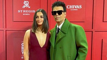 Alia Bhatt & Karan Johar pose together for paps at an event
