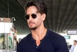 Tiger Shroff gets clicked in a black casual tshirt paired with denims