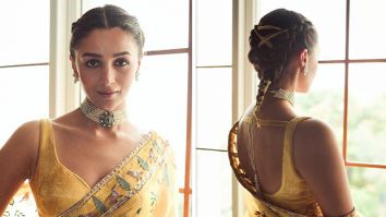 Alia Bhatt exudes regal opulence in yellow aviary pattern saree accentuated with statement pearl neckpiece; her braided hair steals the limelight