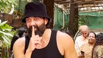 Bobby Deol poses for paps in a bucket hat and his ‘Animal’ signat