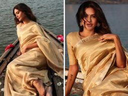 Esha Gupta radiates ethereal elegance in a golden saree against the backdrop of Benaras ghats