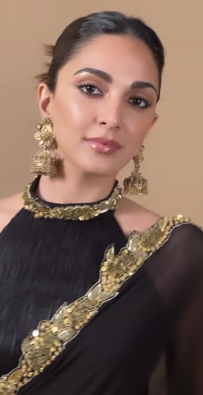 Kiara Advani is elegant as ever in a beautiful black and golden saree