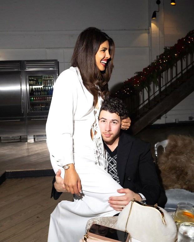 Priyanka Chopra Jonas gives a glimpse of her Christmas holiday season celebrations, as she sits on Nick Jonas’ lap : Bollywood News