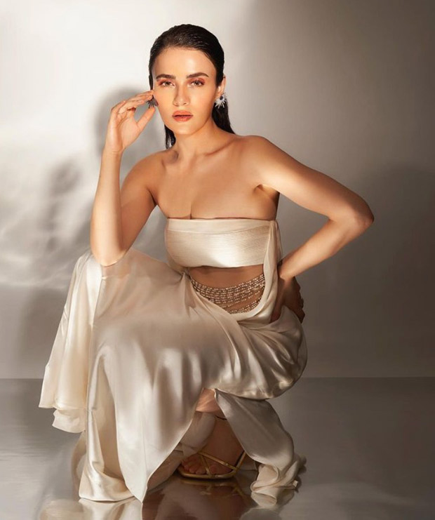 Radhika Madan exudes elegance in an ivory gown adorned with pearl embellishments, making her Christmas attire exceptionally sophisticated