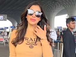Sophie Choudry smiles for paps at the airport