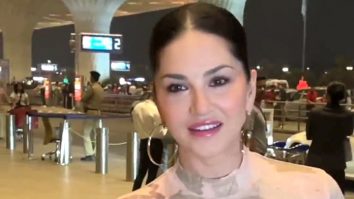 Sunny Leone flashes her infectious smile at the airport as she gets clicked by paps