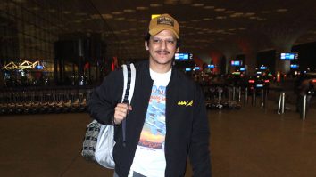 Vijay Varma poses for a picture with fans as he gets clicked at the airport
