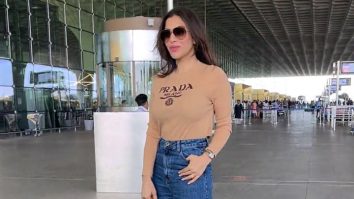Sophie Choudry is all smiles as she greets paps at the airport