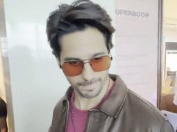 Sidharth Malhotra clicks a selfie with fans at the airport