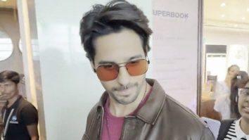 Sidharth Malhotra clicks a selfie with fans at the airport