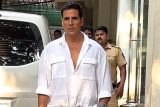 Akshay Kumar poses for paps in a white shirt as he gets clicked