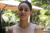 Ananya Panday waves at paps as she gets clicked outside gym
