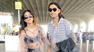 Prateik Babbar strikes a pose with Priya Banerjee as they get clicked at the airport