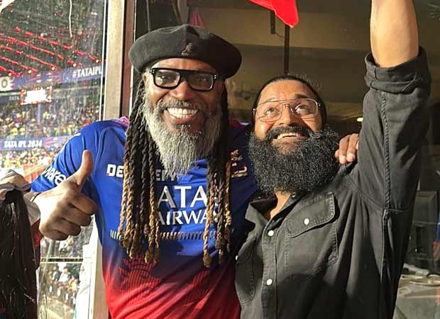 Rishab Shetty poses with Chris Gayle during RCB vs CSK match