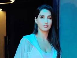 Nora Fatehi flaunts her Louis Vuitton bag as she poses for paps