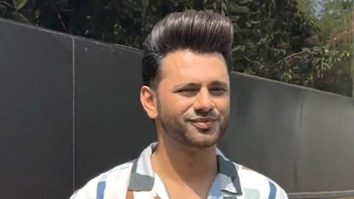 Rahul Vaidya strikes a pose for paps as he gets clicked on set