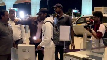 Dhanush poses for a selfie with fans at the airport