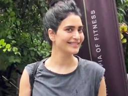 Karishma Tanna displays a happy mood as she gets clicked outside gym