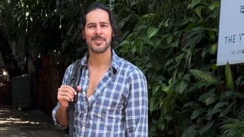 Falling for his dimples! Dino Morea strikes a pose for paps