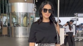 Denim skirt and boots! Sunny Leone’s rocking airport look