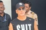 Akshay Kumar in a cool sando which says SHIT HAPPENS
