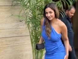 Beautiful Malaika caressing a cute dog