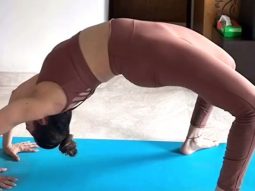 Isha Koppikar practicing her rhythmic yoga