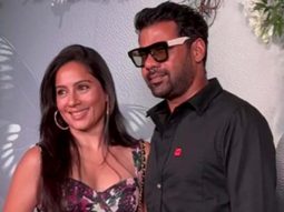 Shabir Ahluwalia in an all black outfit pose with his wife