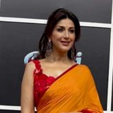 Sonali Bendre looks brightening beauty in an orangish red saree