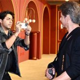 Aryan Khan becomes photographer as Shah Rukh Khan strikes a pose with paparazzi at The Bads of Bollywood premiere