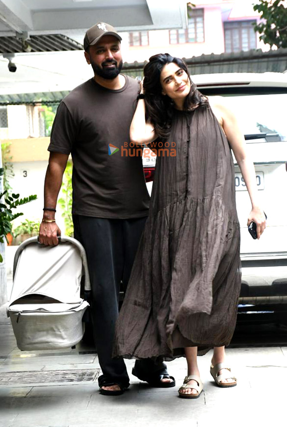 photos karishma tanna snapped with her husband and her newborn child as she returns to her home in bandra 3